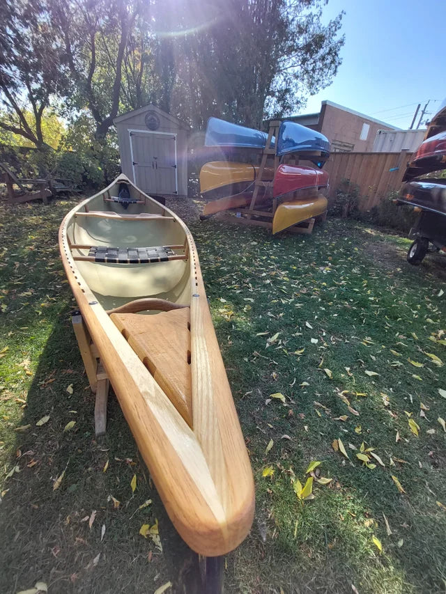 Rheaume Prospector 16'6" Kevlar Canoe with Wood Trim: Known for its excellent stability in both solo and tandem use, the canoe remains highly responsive and easy to maneuver, even under heavy loads. 