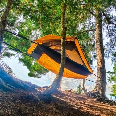 AERIAL A1 Tree Tent Suspended off the ground between two trees.