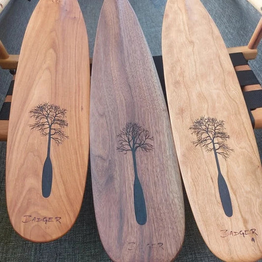 Badger Forest Edition Paddles: Paddle with Purpose  Elevate your paddling experience with our exclusive Badger Forest Edition Paddles, where exquisite craftsmanship meets environmental stewardship. These limited-edition paddles are not just tools for adventure, but symbols of commitment to nature's preservation.