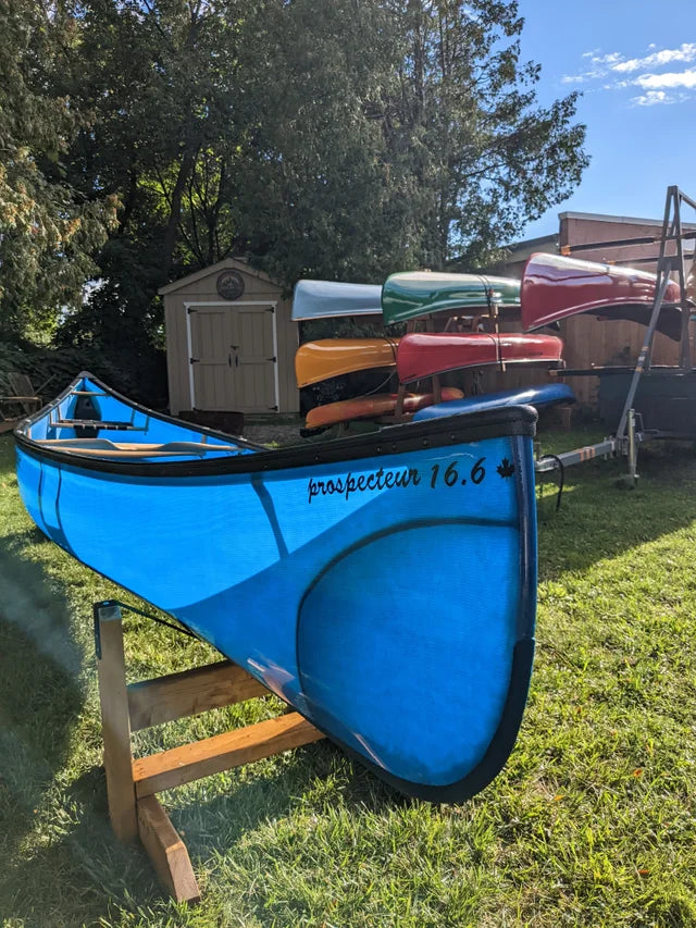 Rheaume 16'6" Prospector Fiberglass Canoe: This canoe's adaptability makes it suitable for any situation, from leisurely lake paddling to navigating river rapids. Its versatility and ease of use have made it a favorite in camps, parks, and schools.