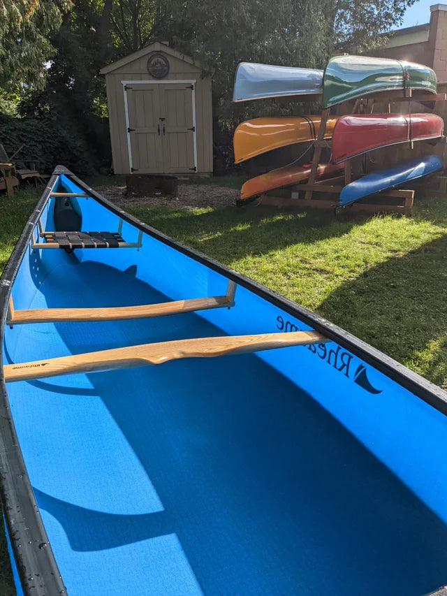Rheaume 16'6" Prospector Fiberglass Canoe:Customizable Options: Tailor your canoeing experience with various options, including a deep dish yoke for comfortable portaging, matching color skid plates for added protection, and a kneeling thwart for alternative paddling positions.