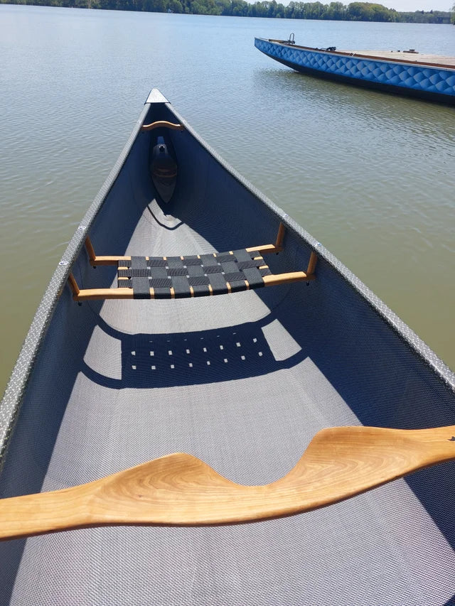 Embark on your next water adventure with the Rheaume Prospector 16'6" Carbon Canoe. It's not just a canoe; it's a testament to the fusion of agility, stability, and lightweight design, promising an unmatched paddling experience for enthusiasts of all levels.